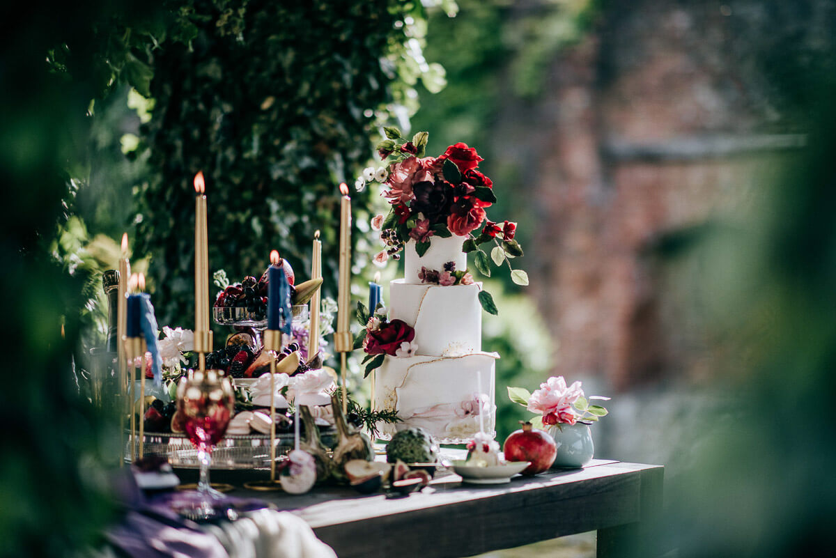 A table set up outside for an intimate bucket-list alfresco wedding dining experience at The Castle Westenhanger