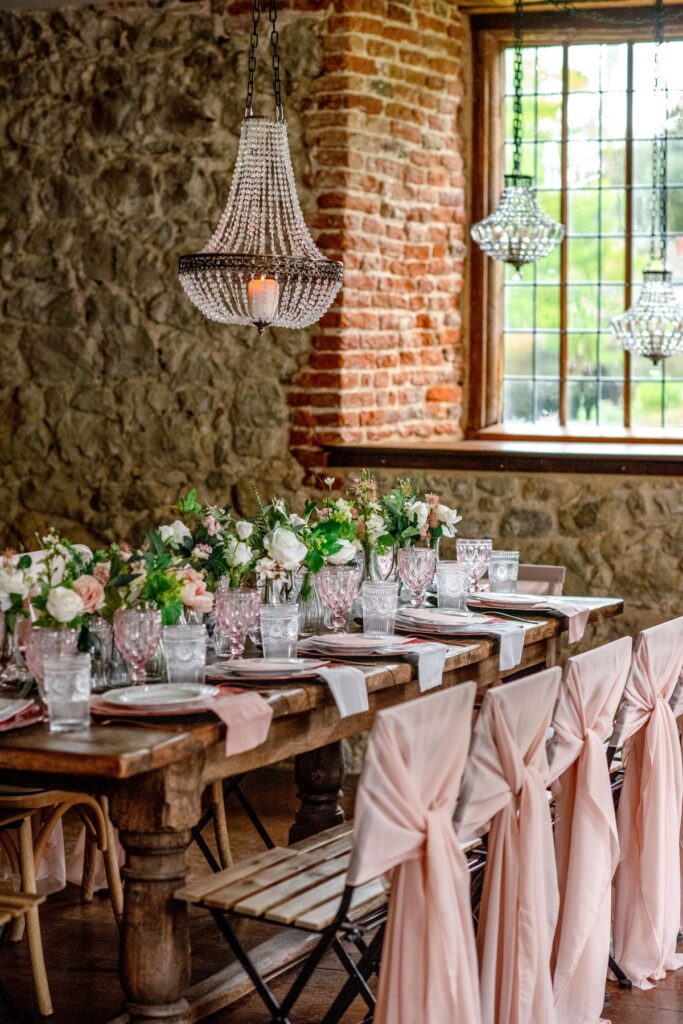 A pink tablescape for Aidan and Rachels tiny wedding at the Castle Westenhanger, Kent, England