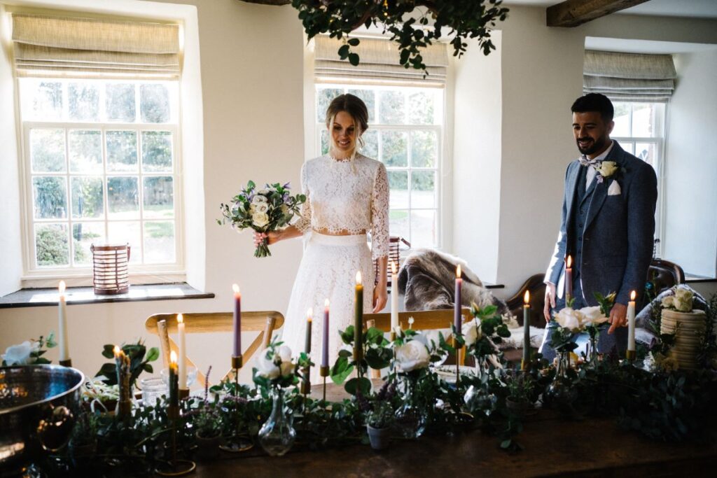 A couple admire their sweetheart table