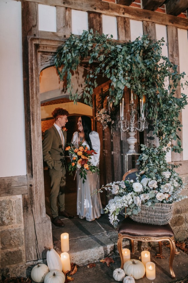 couple by a decorated doorway