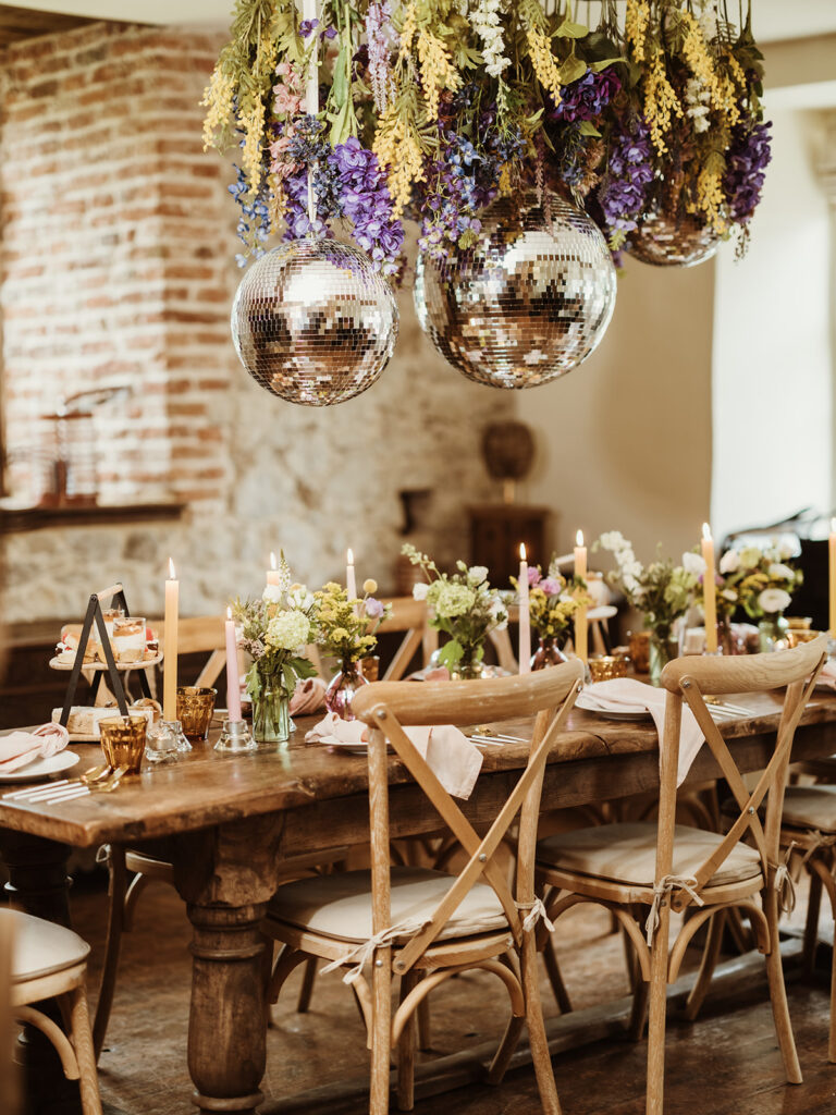 Disco balls and flowers over a table