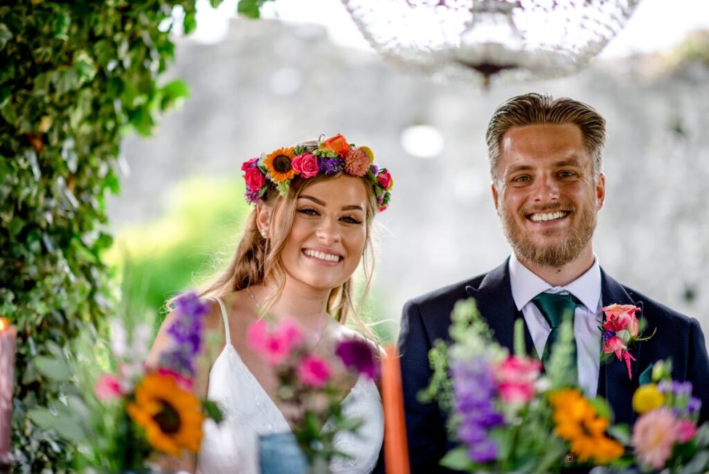 Kirsty and Steve's real elopement at the Castle Westenhanger in Kent by team E-Lope. The tiny gathering dine alfresco under the thatched gazebo