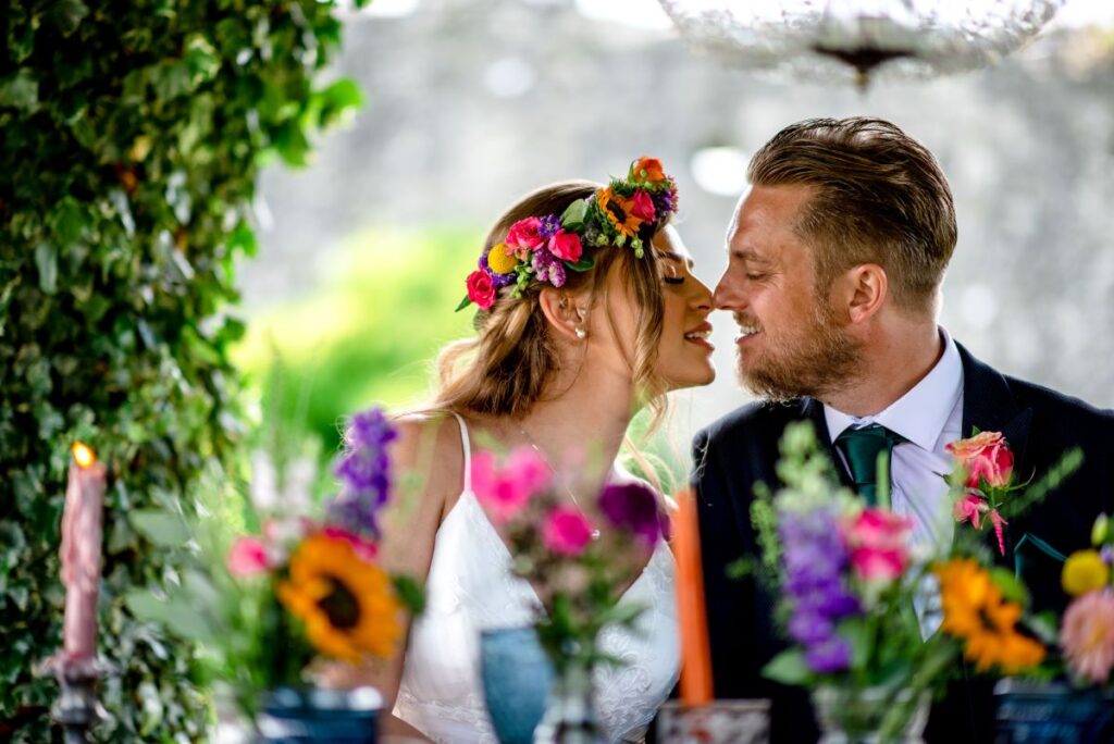 Kirsty and Steve's real elopement at the Castle Westenhanger in Kent by team E-Lope. The tiny gathering dine alfresco under the thatched gazebo