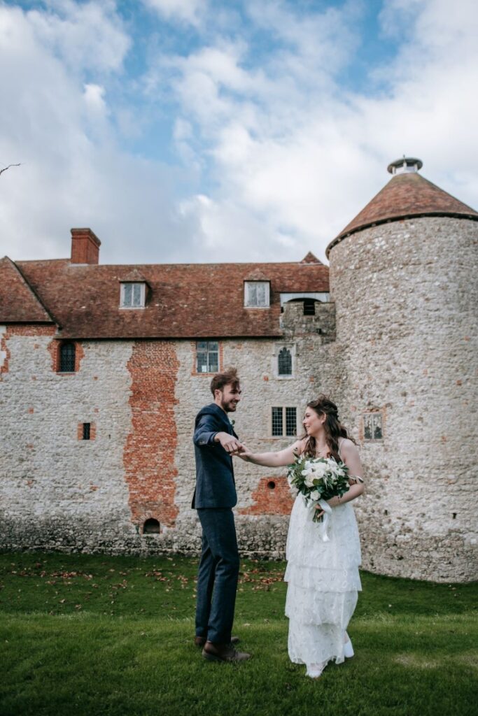 The eloped couple stand in front of the Castle Westenhanger, Kent, Southeast England