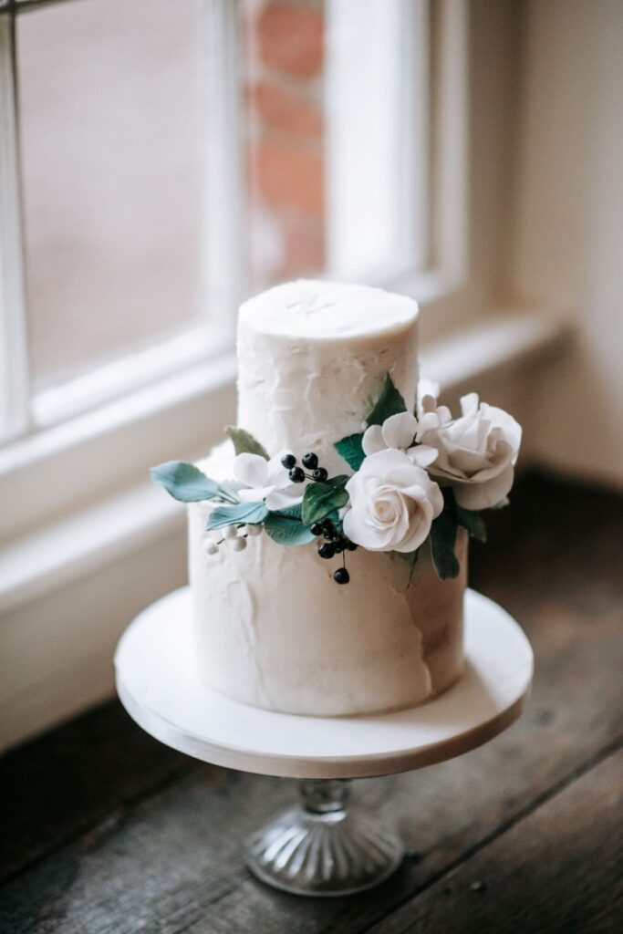 An elopement vegan wedding cake in the window sill of the Castle Westenhanger, Kent, Southeast England
