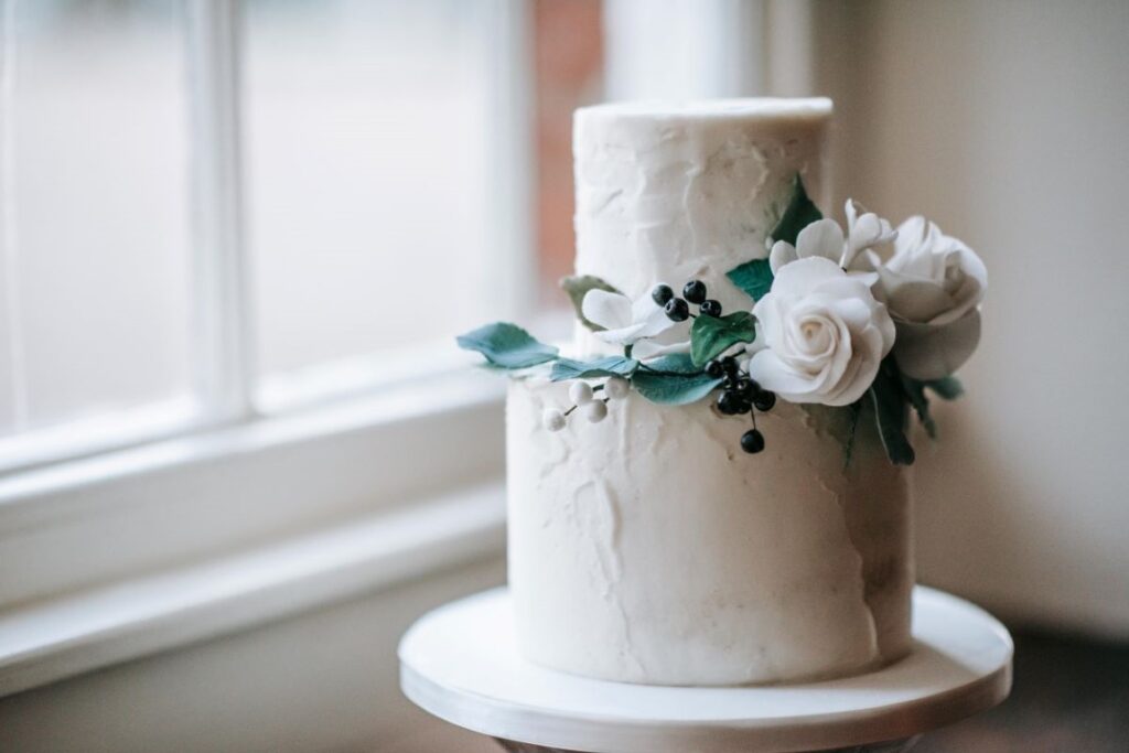 An elopement vegan wedding cake in the window sill of the Castle Westenhanger, Kent, Southeast England