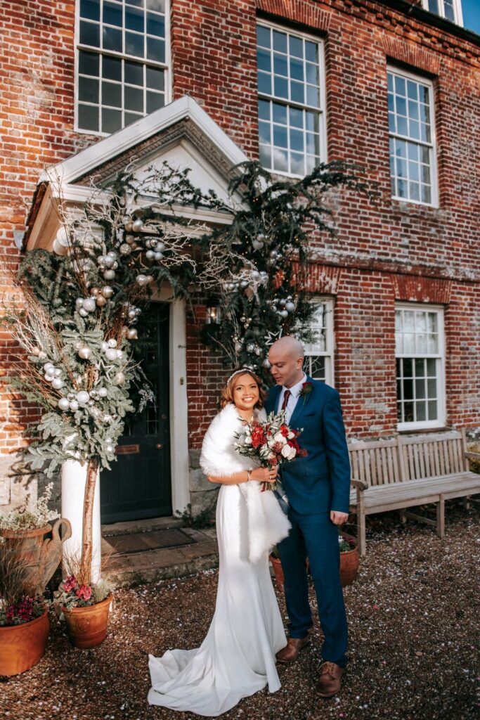 Kate and Ryan stood outside the Mansion at the Castle Westenhanger decorated by Ruth from House of Mimi Fleur