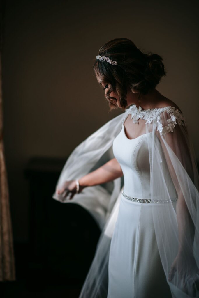 Kate dancing in her gorgeous wedding dress and cape in the Castle Westenhanger Kent England