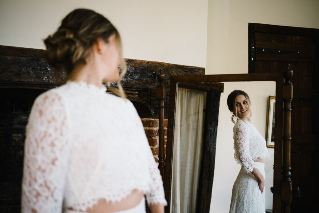 Our brides gets ready for her elopement in the Dovecote at The Castle Westenhanger Kent England