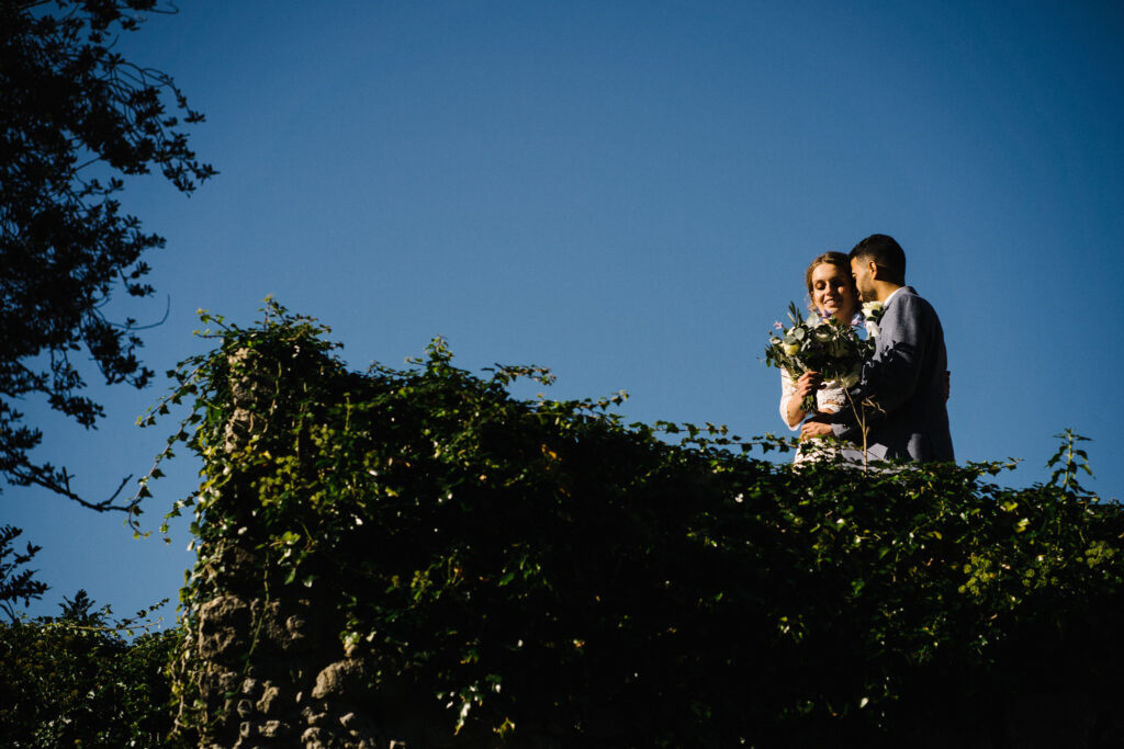 The couple who have just eloped stand on the Castle Westenhanger battlements in Kent England