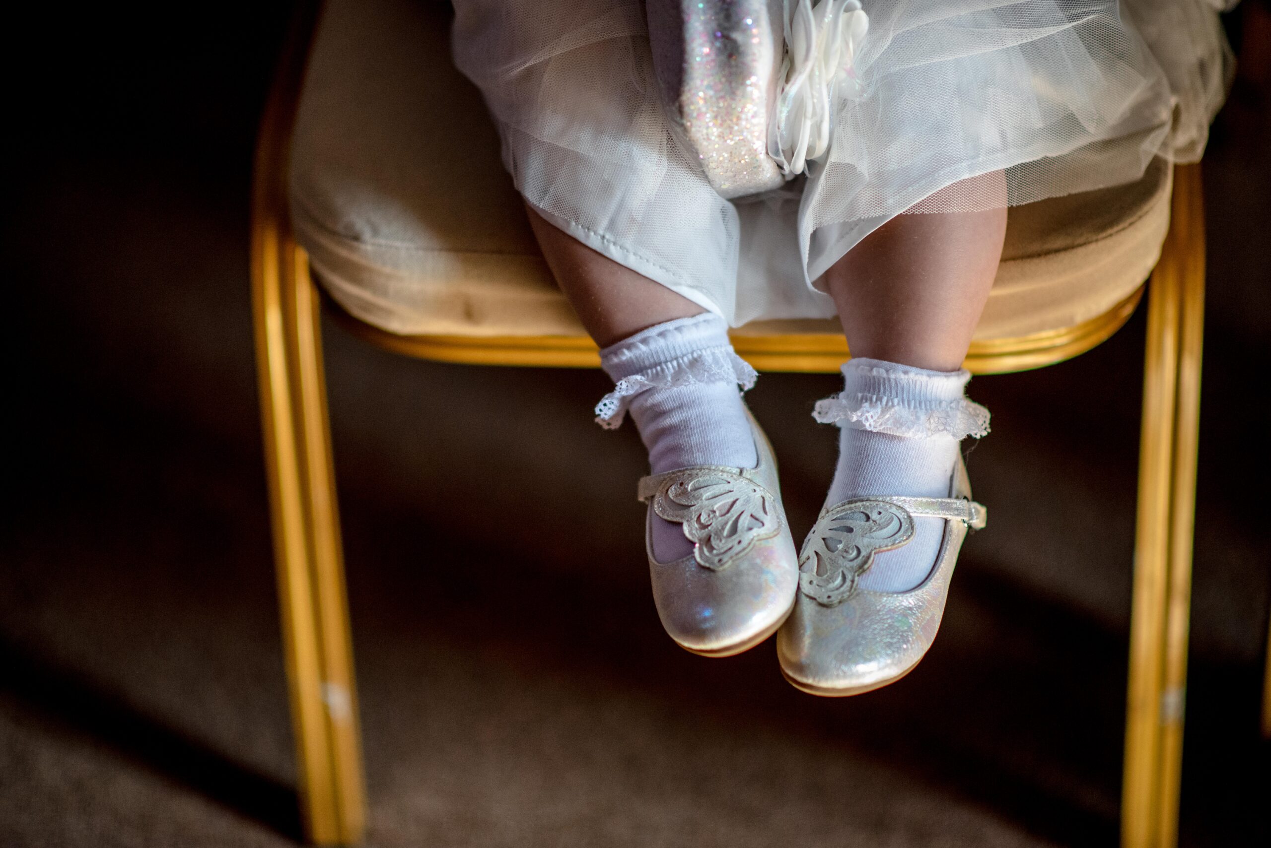 A picture of a baby girls feet dressed for a tiny wedding at the Castle Westenhanger