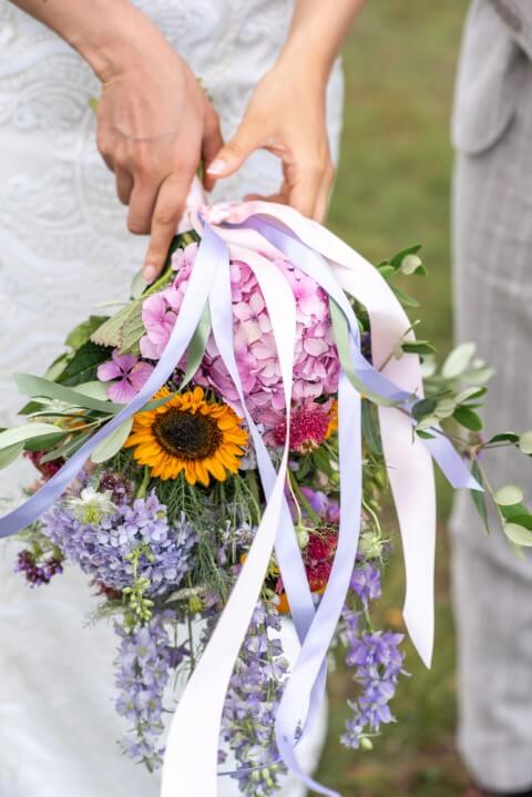 A couple's E-Lopement bouqet after they have legally eloped in the grounds of Bilsington Priory, near Ashford, Kent, England, United Kingdom