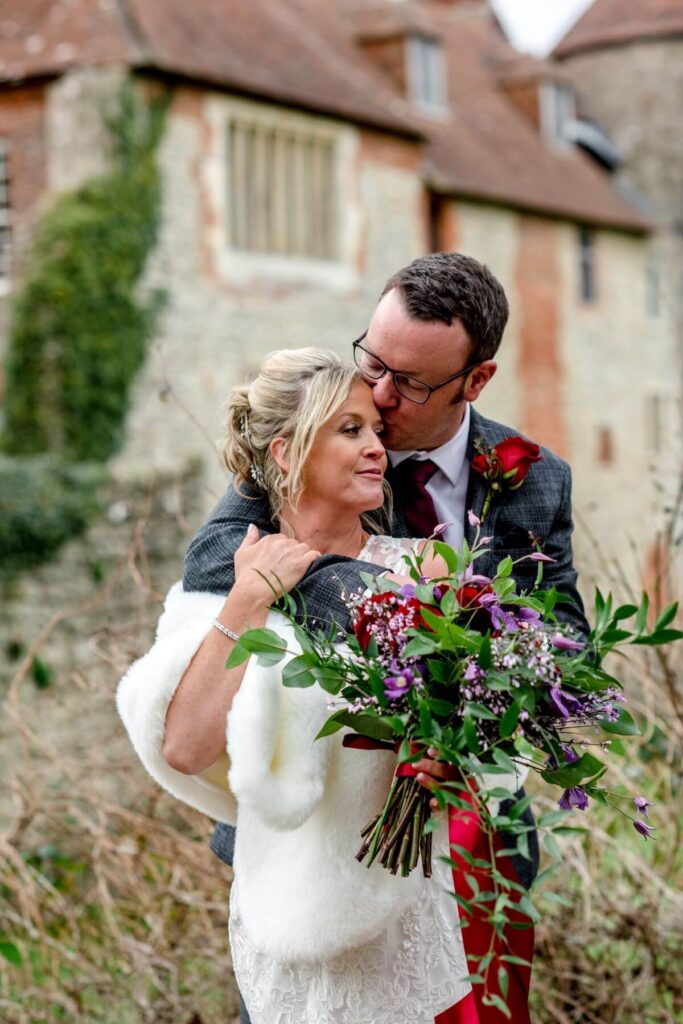 Emma and Paul's purple and red elopement with birds of prey at the Castle Westenhanger in Kent