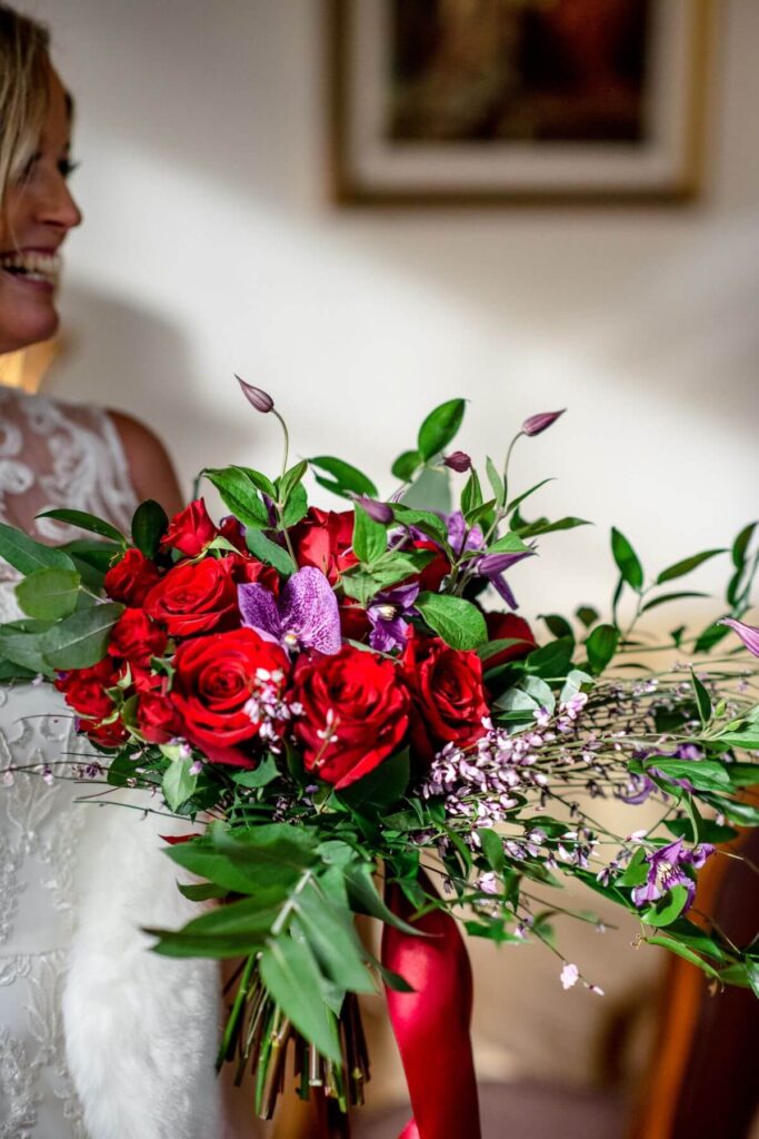Emma and Paul's purple and red elopement with birds of prey at the Castle Westenhanger in Kent