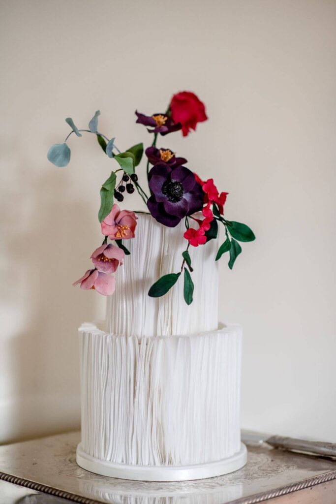 Emma and Paul's purple and red elopement with birds of prey at the Castle Westenhanger in Kent