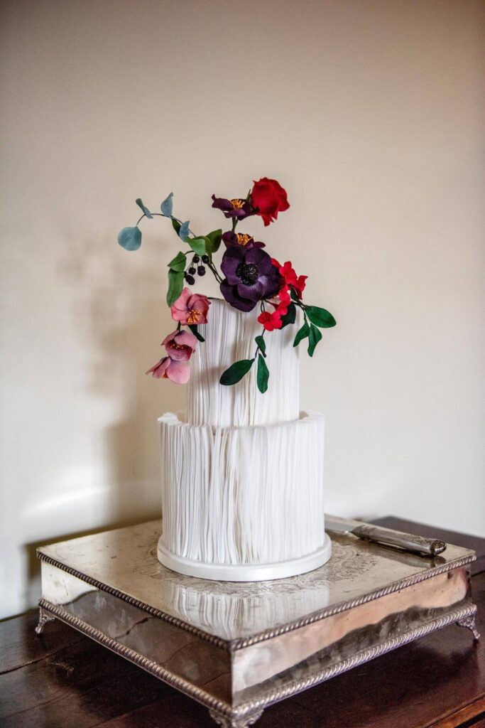 Emma and Paul's purple and red elopement with birds of prey at the Castle Westenhanger in Kent