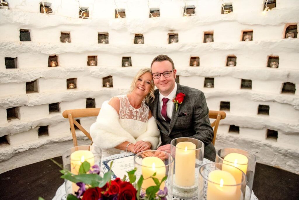 Emma and Paul's purple and red elopement with birds of prey at the Castle Westenhanger in Kent