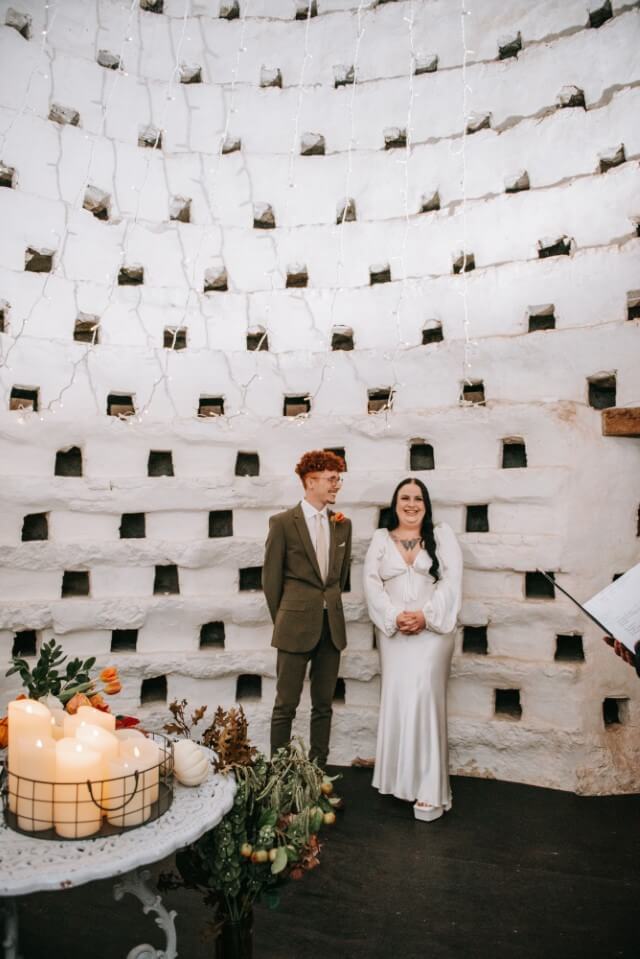 A couple inside the Dovecote at the Castle Westenhanger licenced for tiny, small, micro, petite weddings and elopements