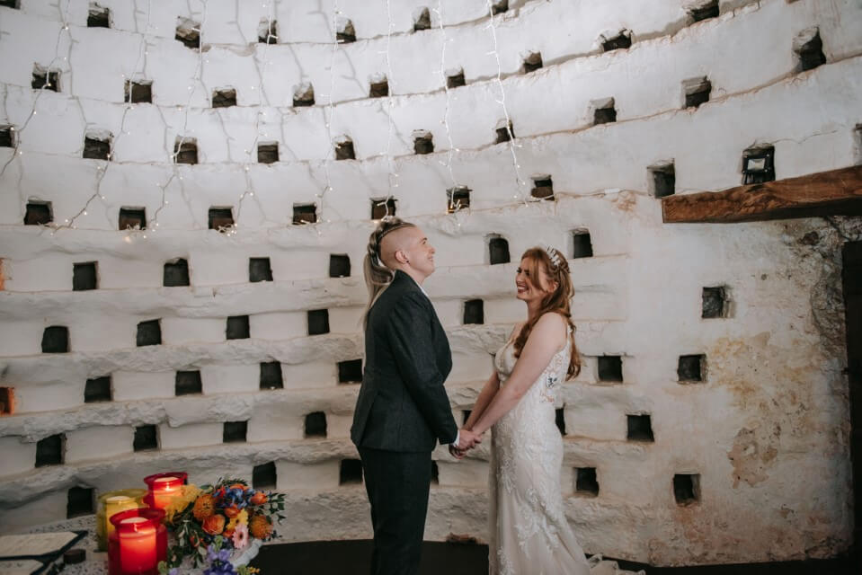 A couple say I do Inside the Dovecote of the Castle Westenhanger in Kent licenced for elopements, tiny and petite weddings