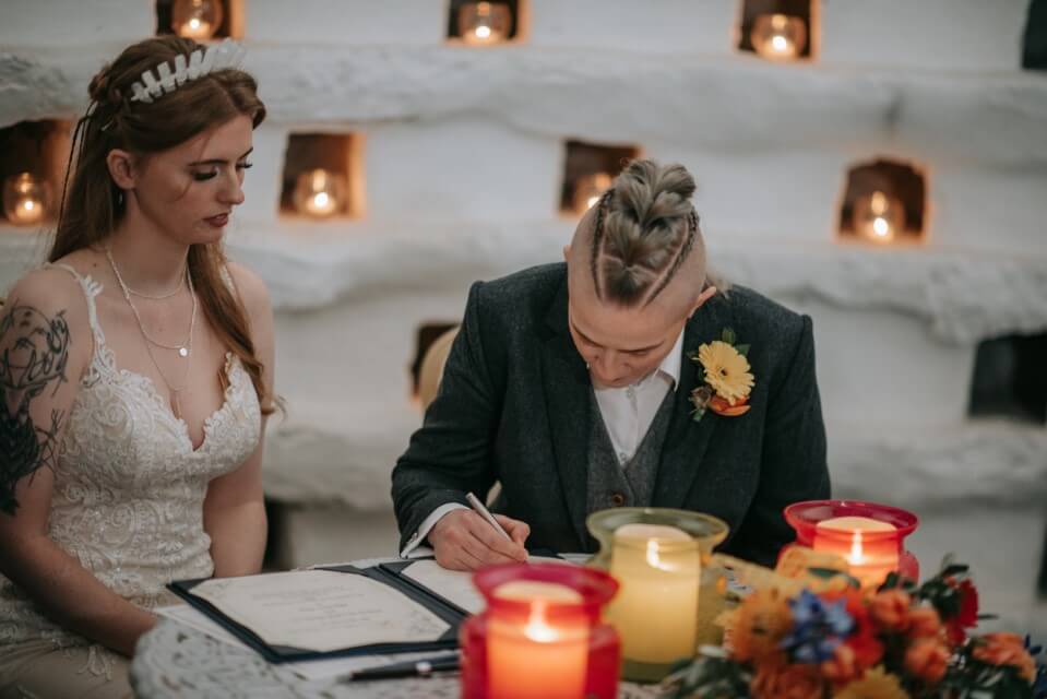 A couple say I do Inside the Dovecote of the Castle Westenhanger in Kent licenced for elopements, tiny and petite weddings