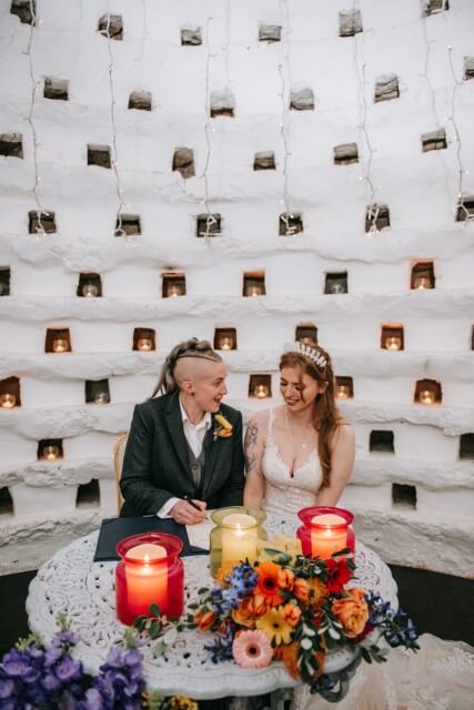 A couple say I do Inside the Dovecote of the Castle Westenhanger in Kent licenced for elopements, tiny and petite weddings