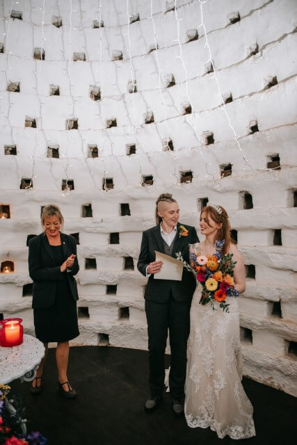 A couple say I do Inside the Dovecote of the Castle Westenhanger in Kent licenced for elopements, tiny and petite weddings