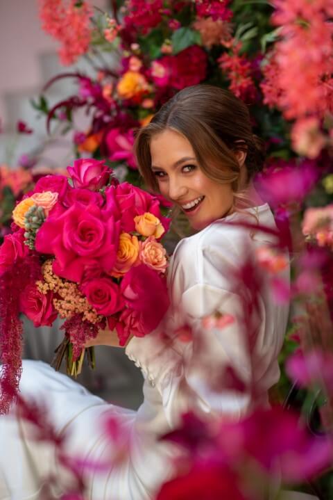 The bride in the Moroccan Courtyard within the Mansion at Port Lympne, Kent, England set up for a luxury elopement with team E-Lope