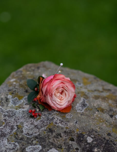 A button hole created by Ruth of House of Mimi Fleur for an Autumn elopement at the Castle Westenhanger, Kent, England